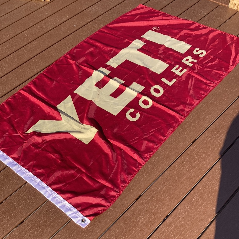Yeti coolers flag.  Red and gold.